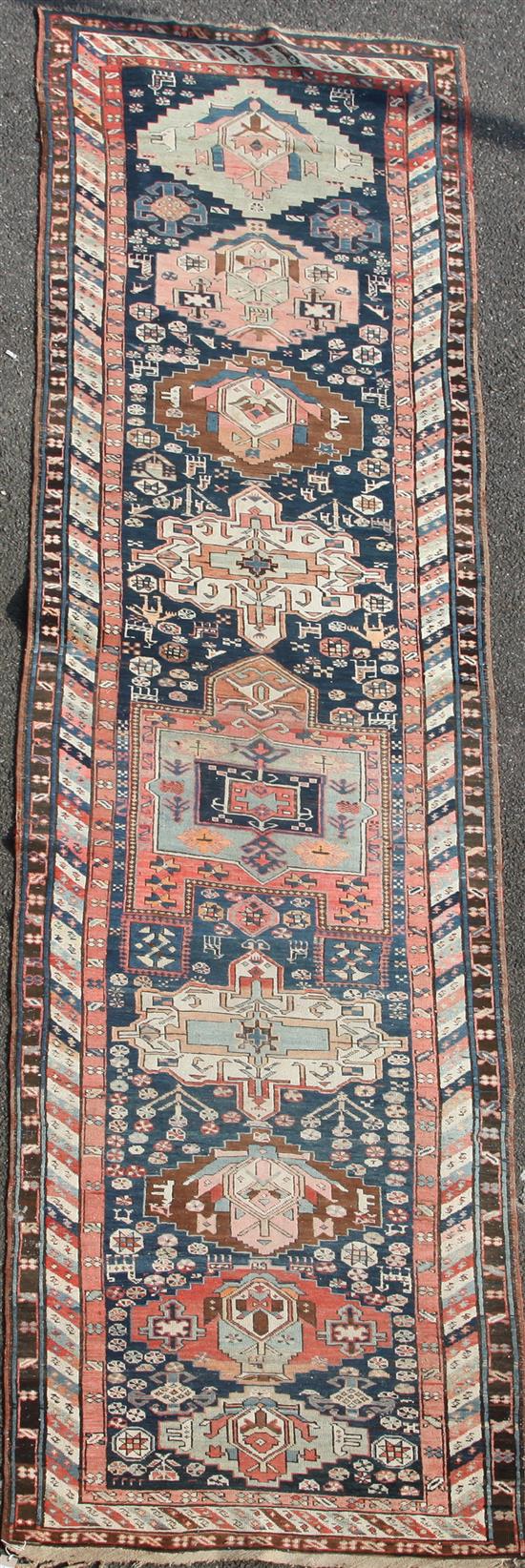 A Shirvan blue ground runner, c.1900, 15ft 6in by 3ft 7in.